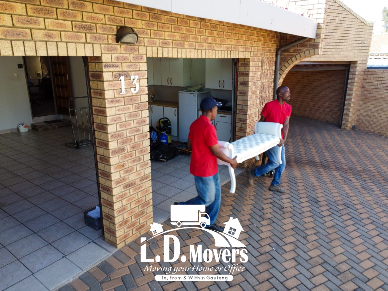 L.D. Movers crew carrying furniture